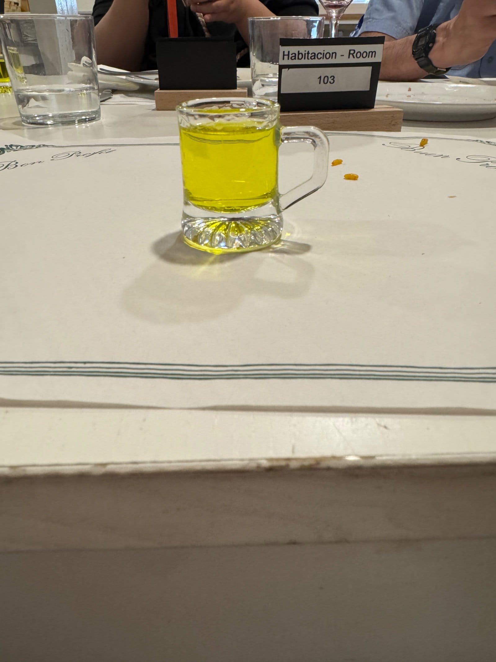 Orujo digestif in glass mug at dinner