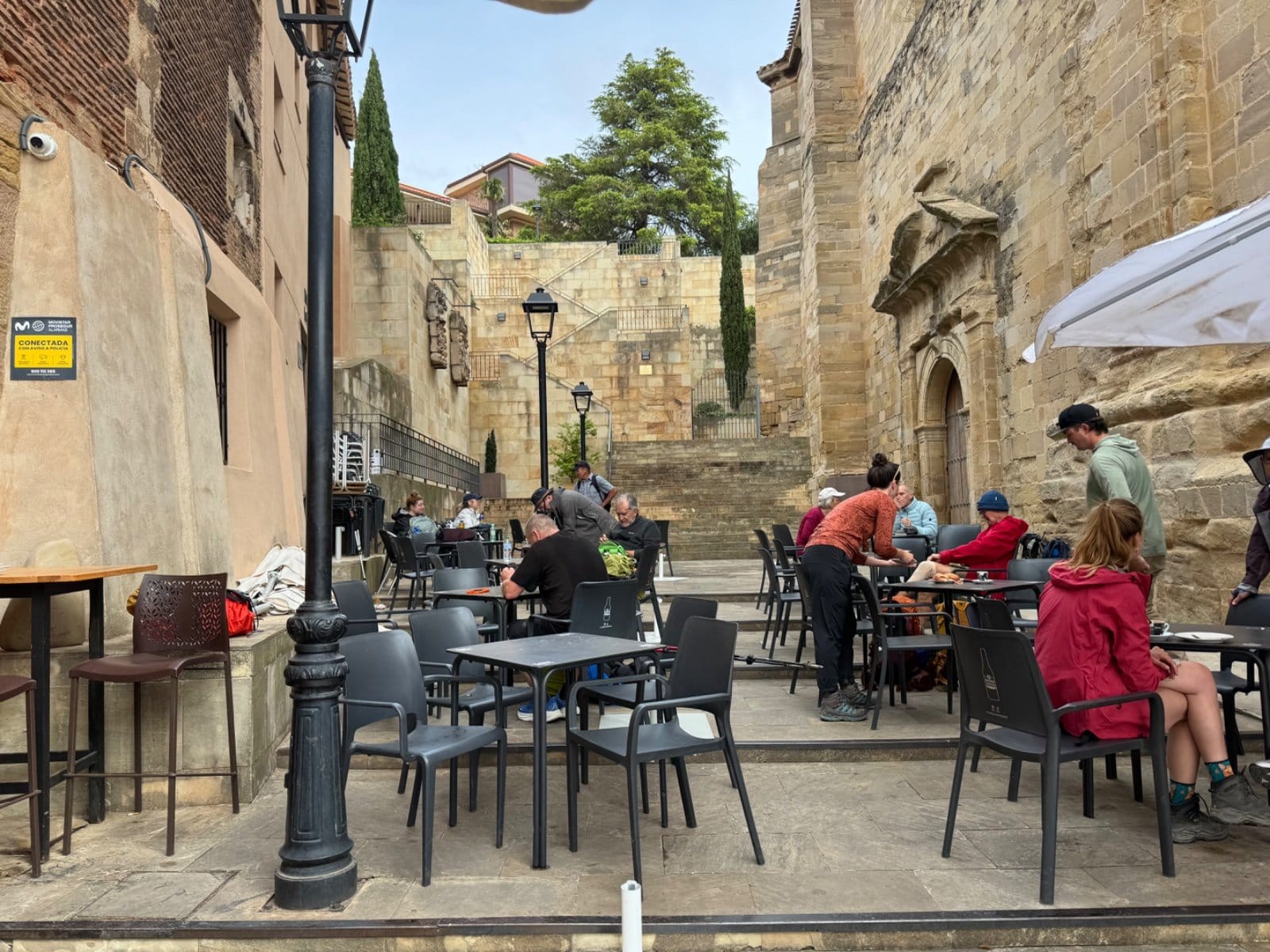 Typical Camino bar scene with pilgrims socializing, Nájera