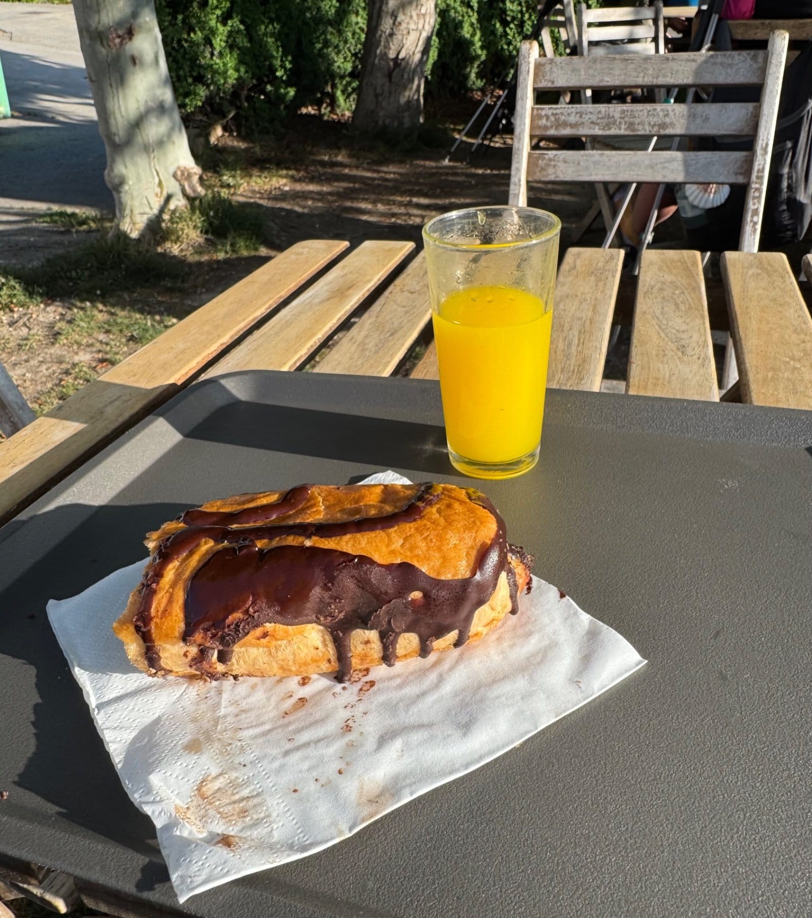 Breakfast pastry and orange juice at bar