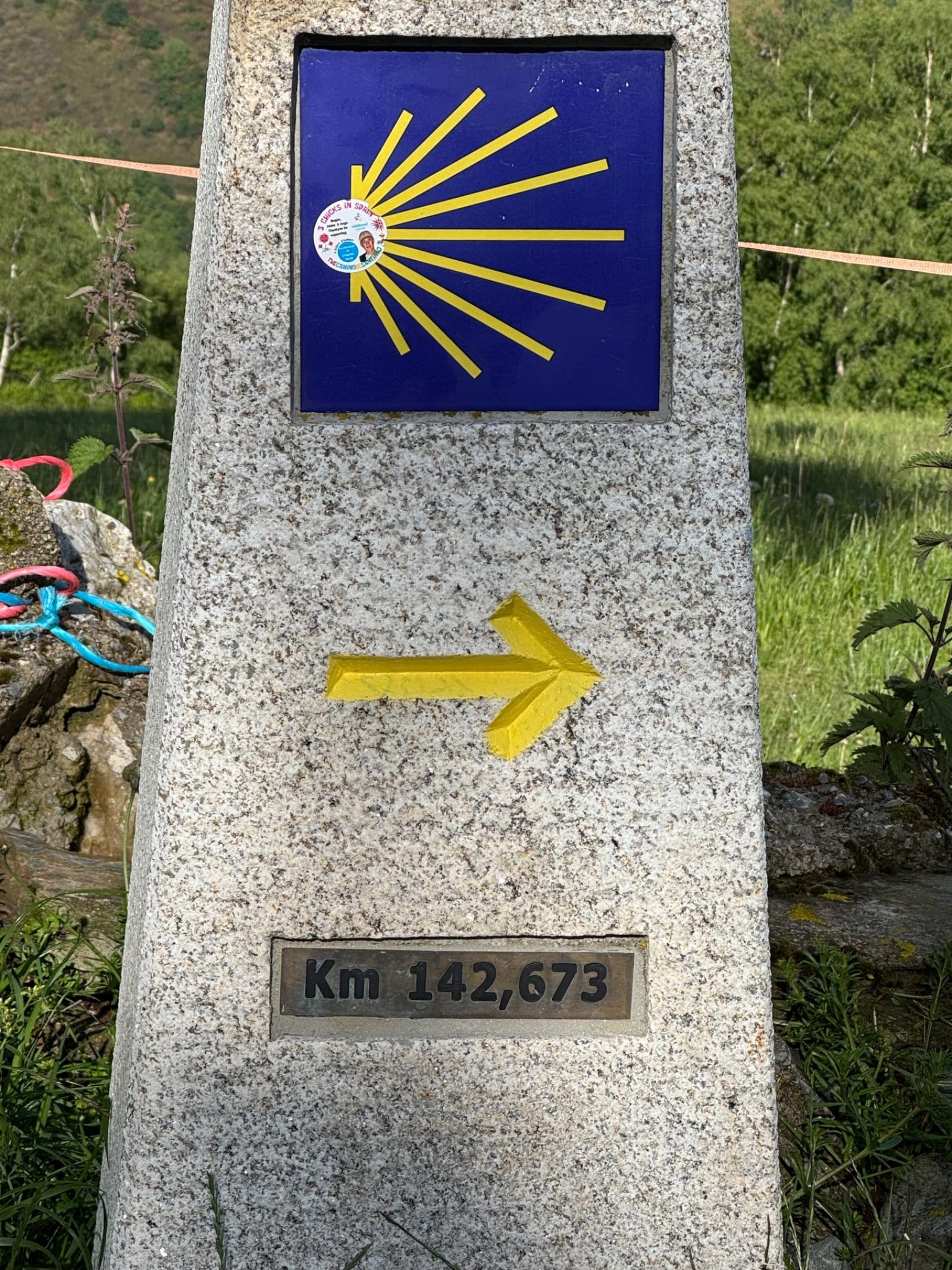 Camino milestone showing 142.673km to Santiago