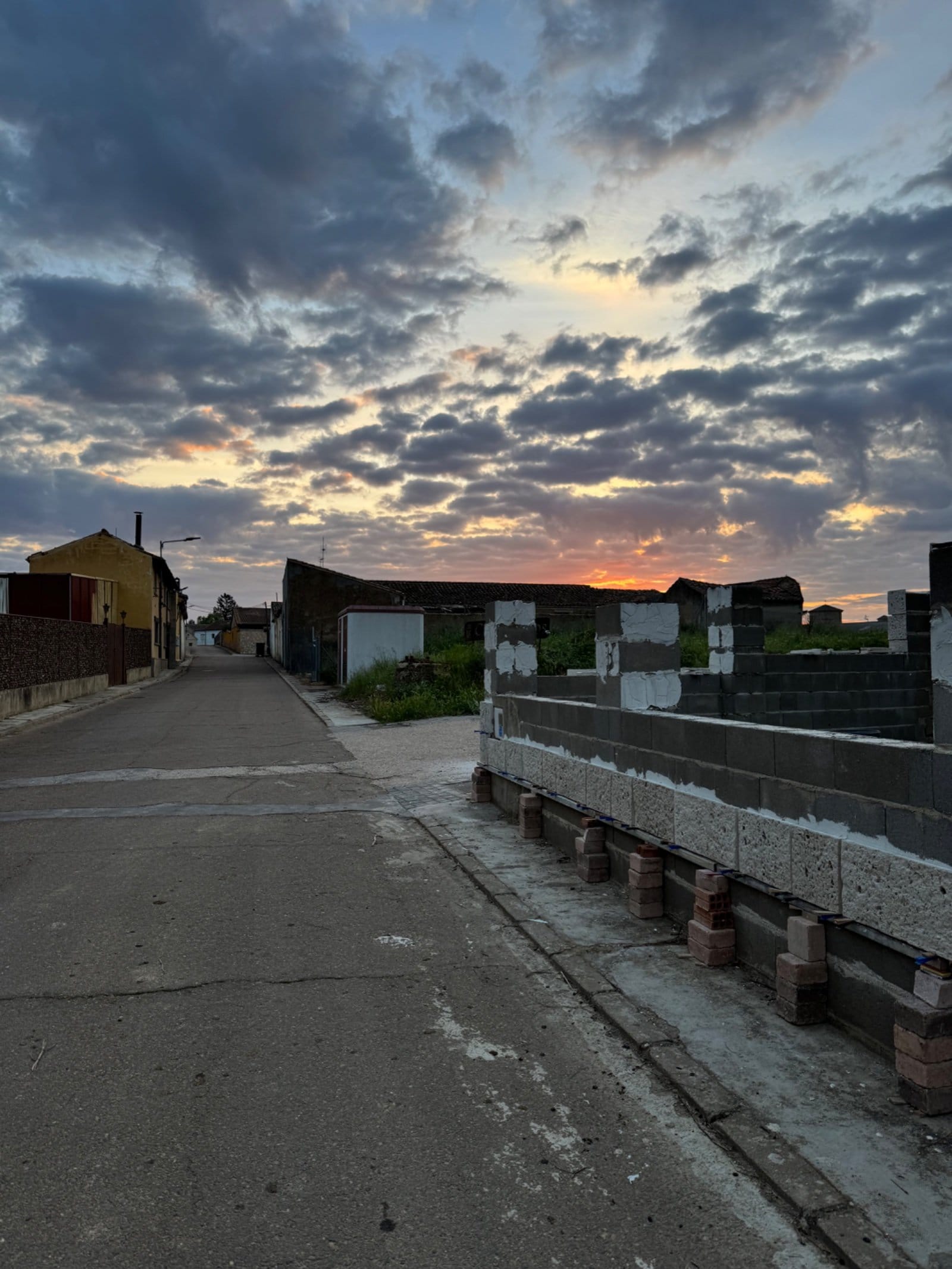Sunset over small Meseta village construction area