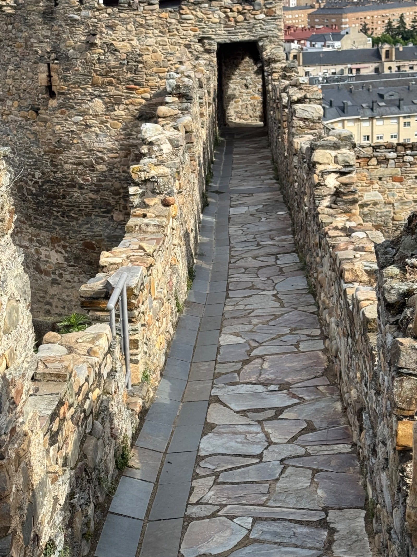 Stone walkway along castle walls in Ponferrada