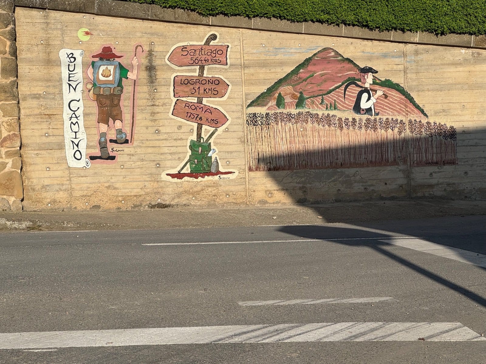 Distance markers to Santiago, Logroño, and Roma