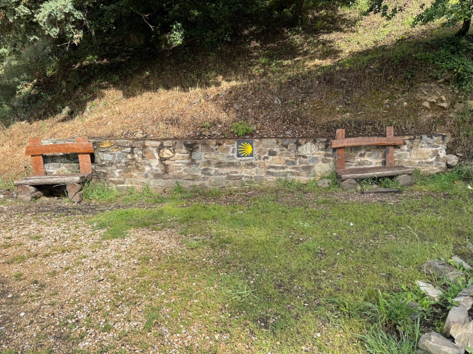 Camino shell marker and stone benches