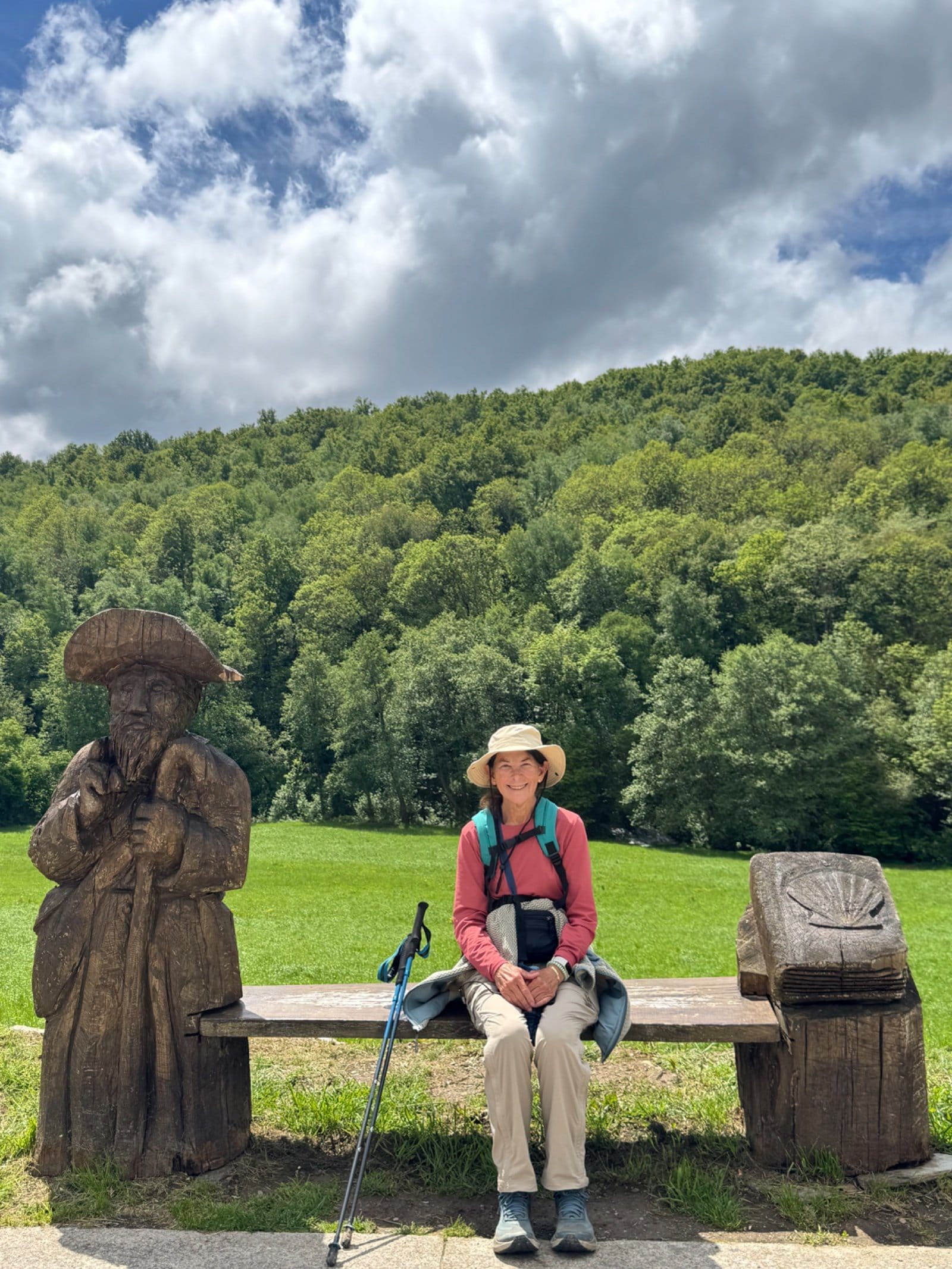 Shelley resting at pilgrim bench near Triacastela