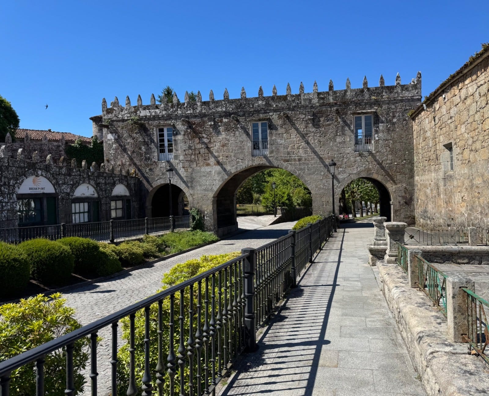 Medieval monastery courtyard with stone arches