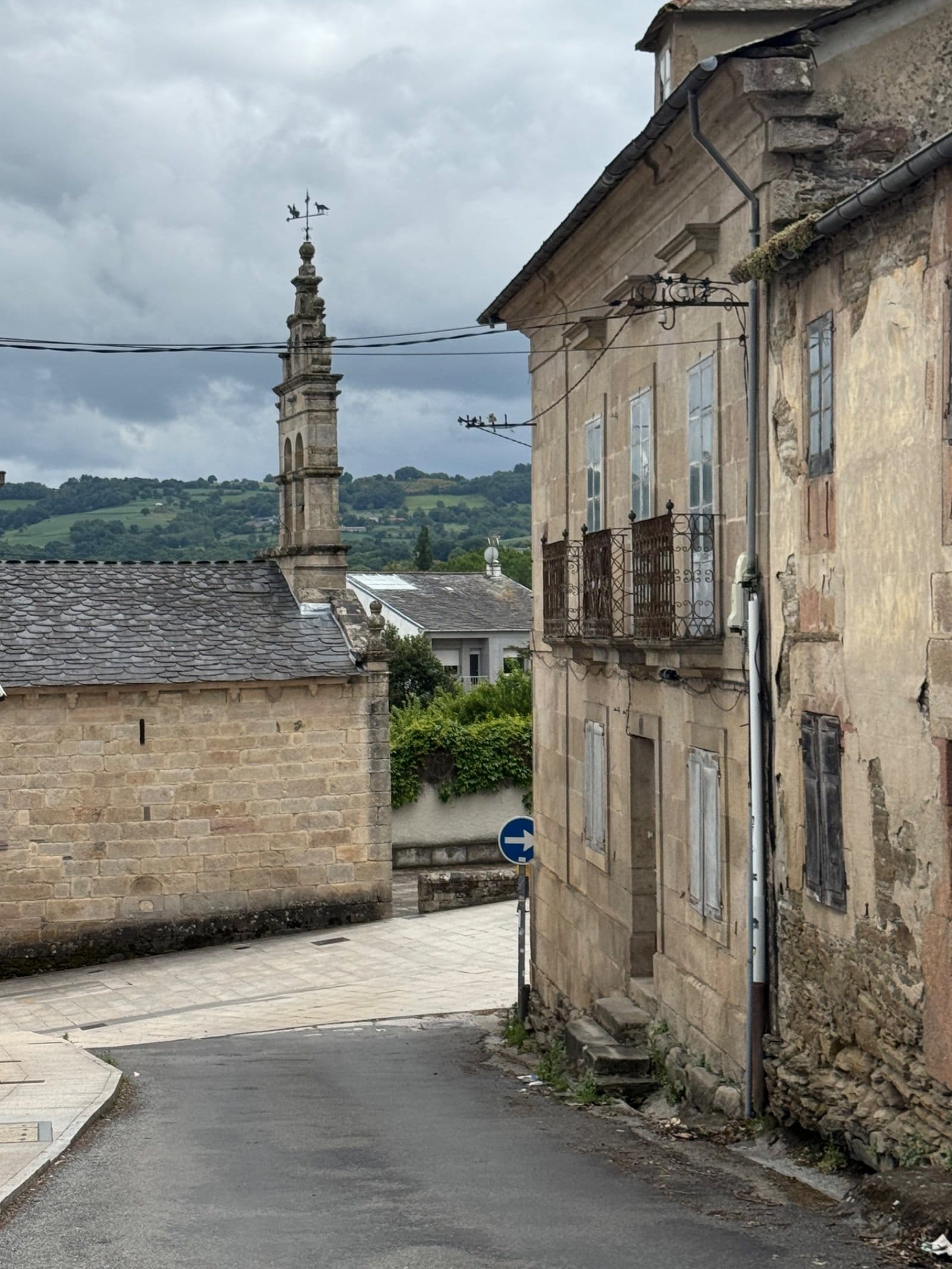 Stone church bell tower in Galician village