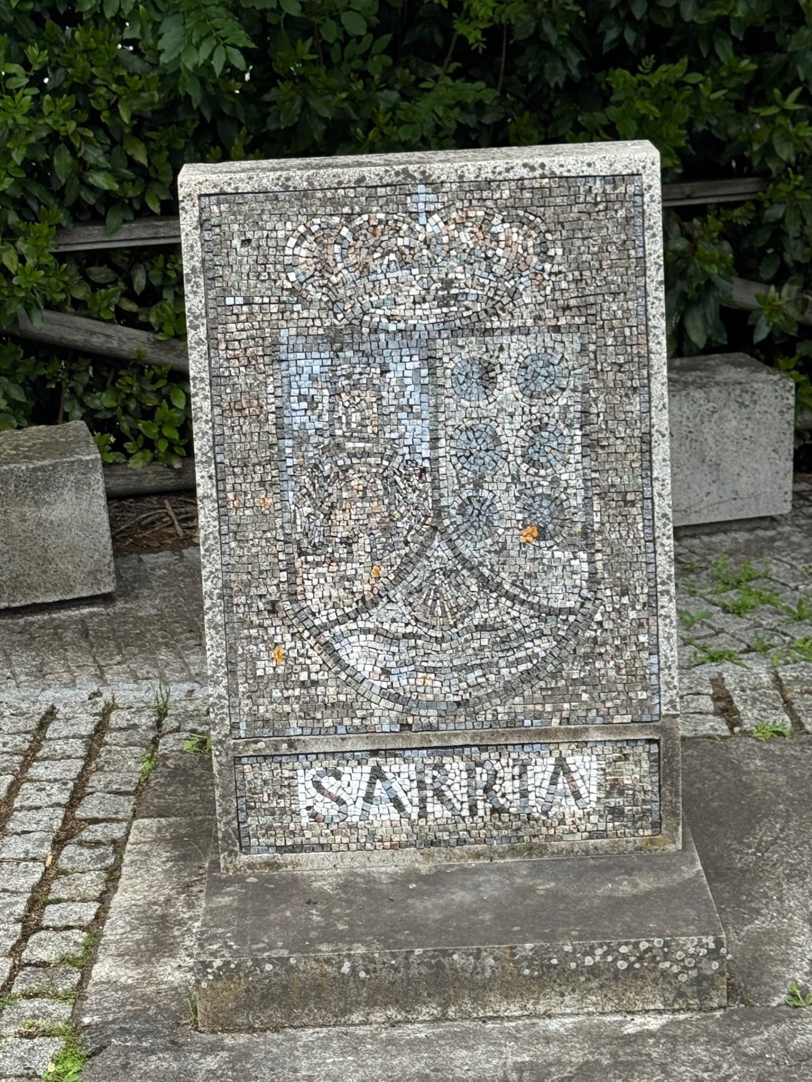 Mosaic plaque marking Sarria on Camino route