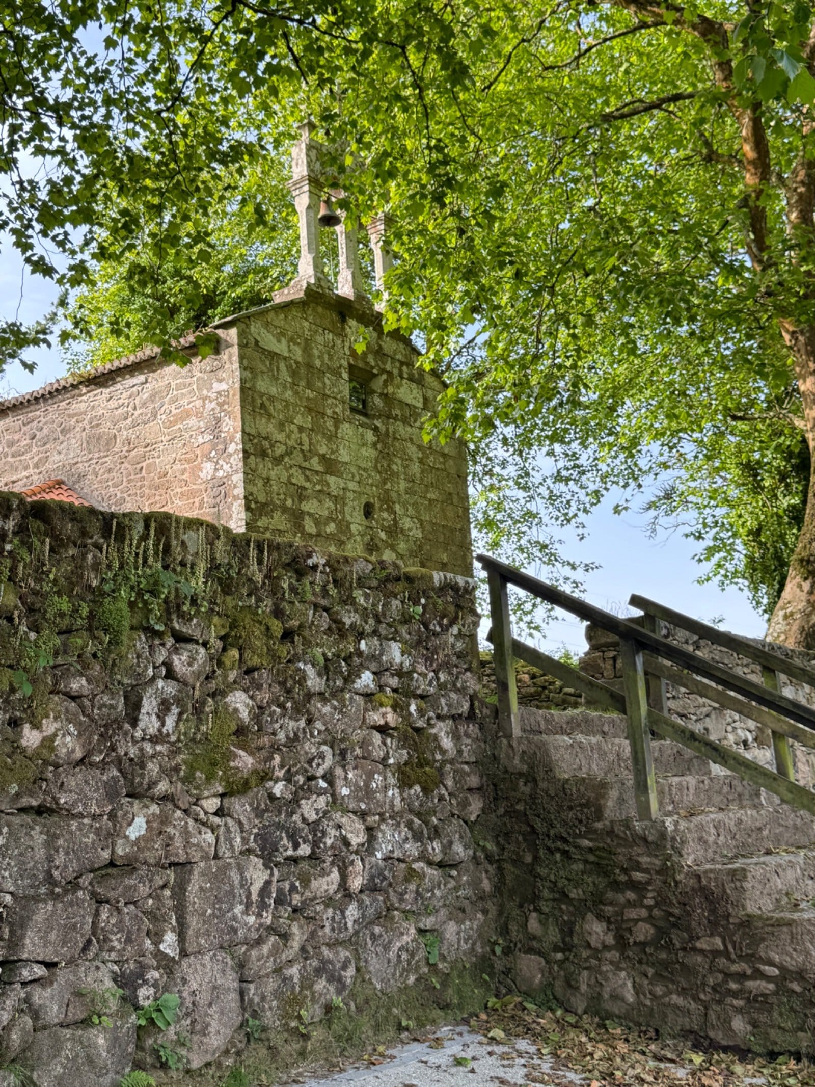 Stone church ruins along coastal Camino route