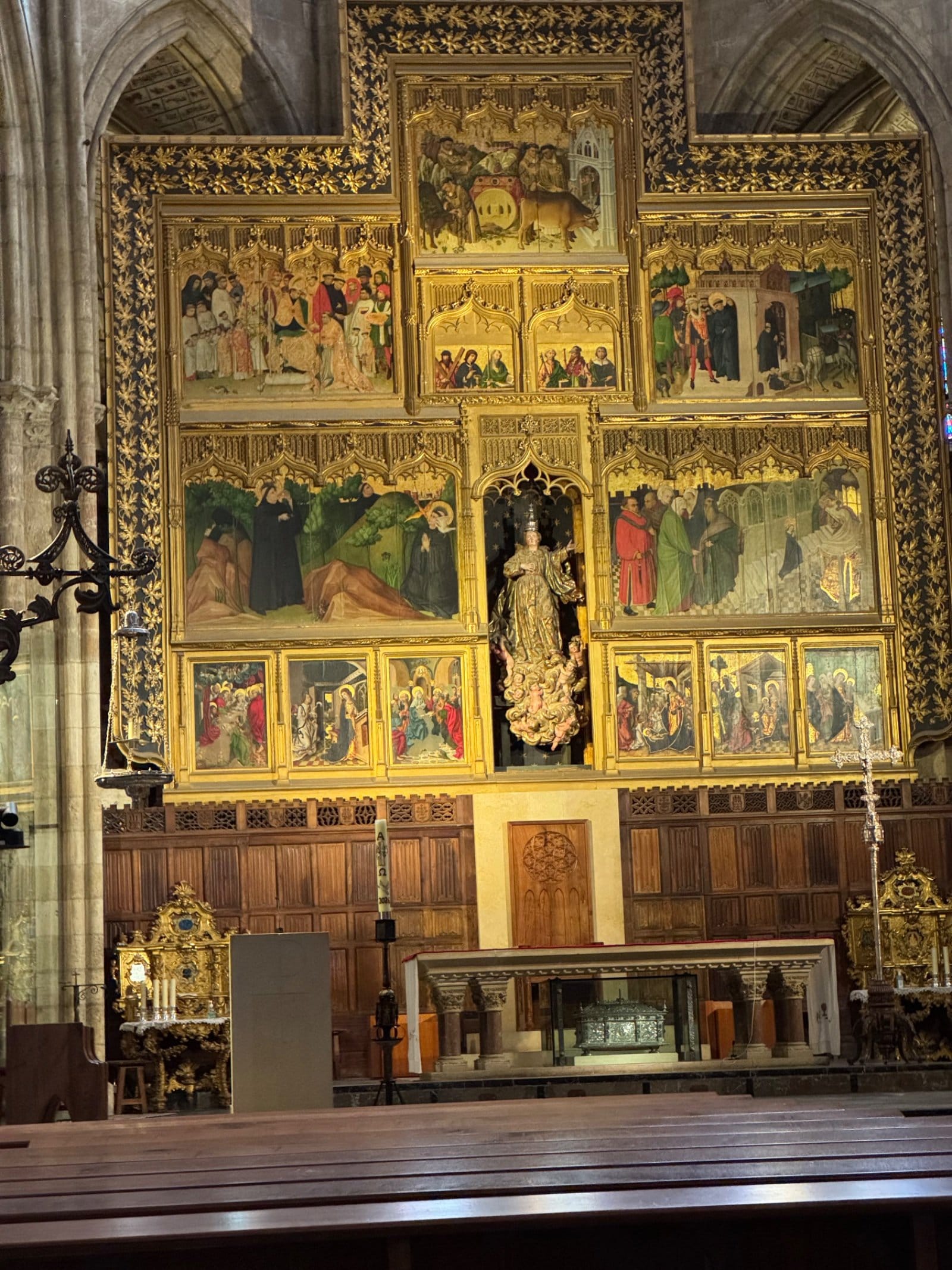 Cathedral altarpiece with golden religious paintings