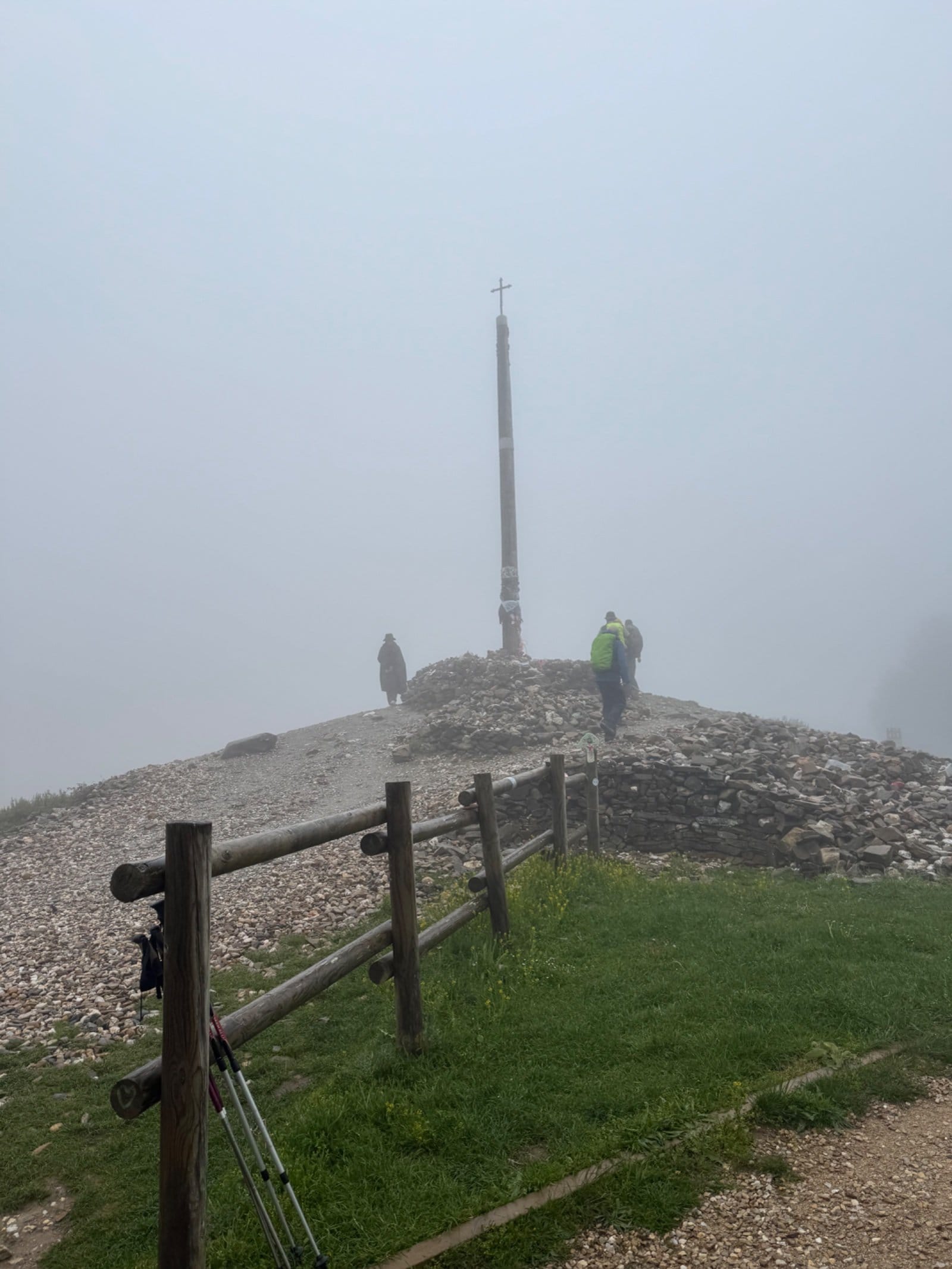 Cruz de Ferro with stone mound in mist